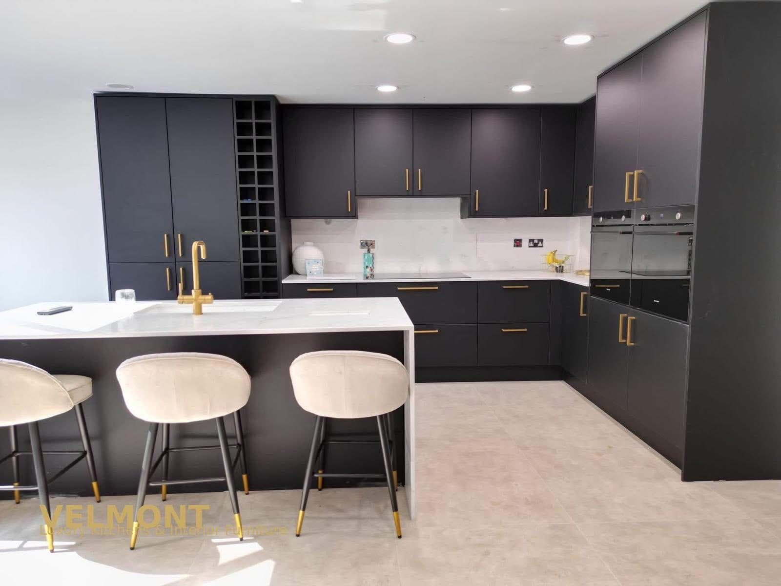 Matt Black Kitchen with Brass Handles and an Open Wine Rack